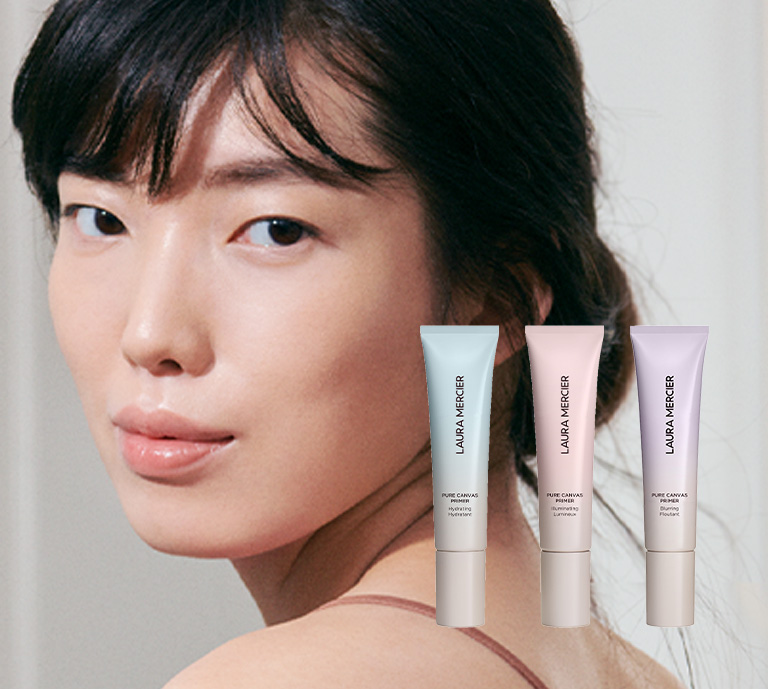 Model and new Laura Mercier Pure Canvas Primers with copy "The next generation of primers powered by 85% skincare for up to 16hr wear."