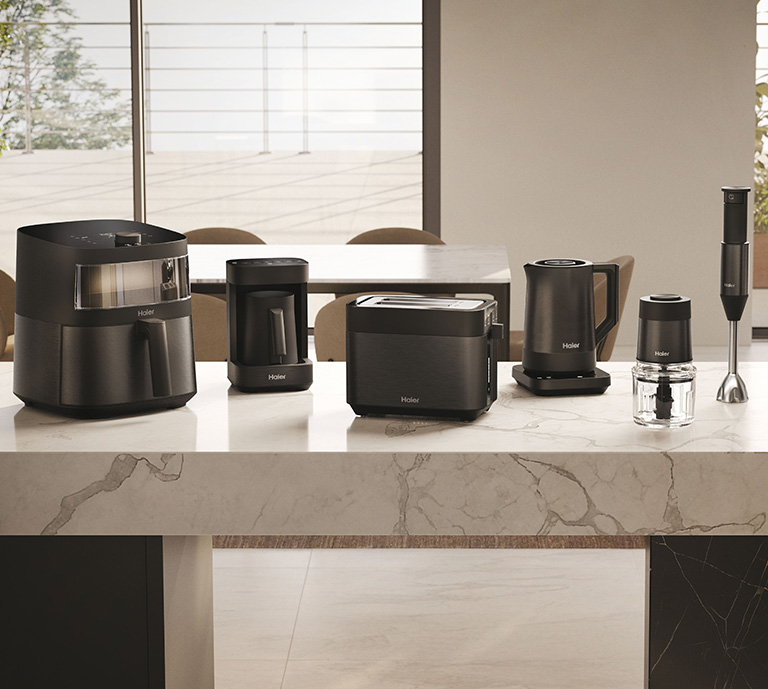 Range of Haier small kitchen appliances including air-fryer, barista machine, toaster, kettle and blenders