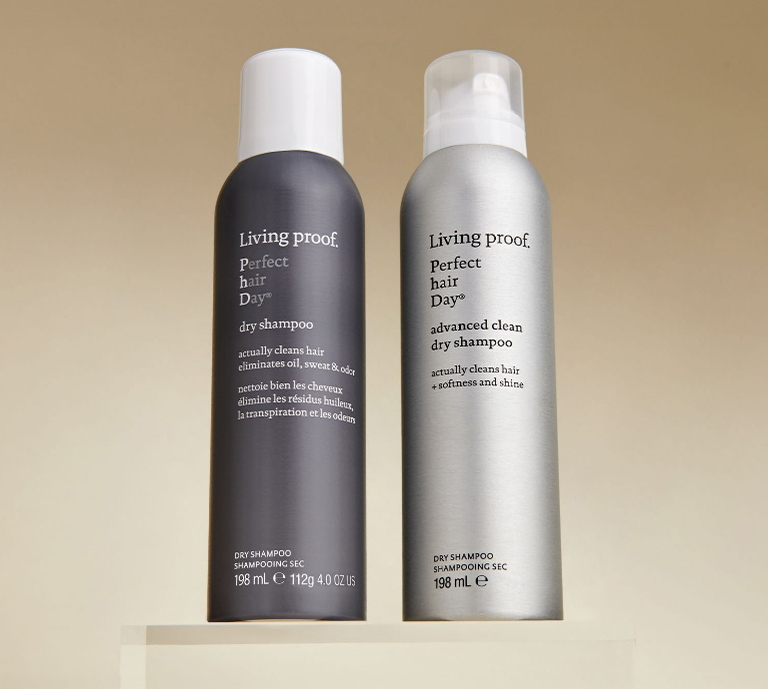 Two cans of Dry Shampoo from Living proof