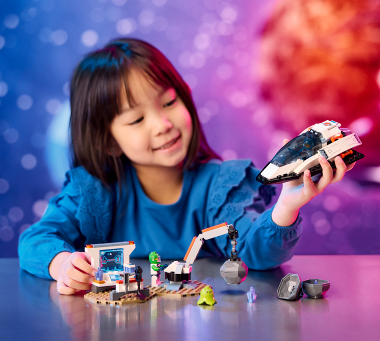 Banner Advertisement for LEGO sets featuring space related products with an image of different products in a space like environment